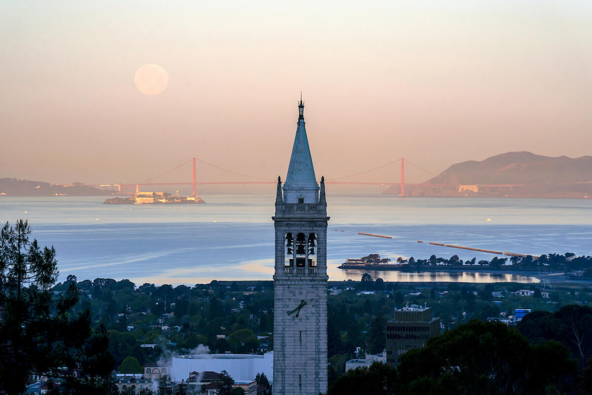 A “pink” supermoon sets behind UC Berkeley’s Campanile in Berkeley, Calif. on Tuesday, April 27, 2021